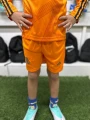 Футбольна форма з довгим рукавом дитяча Реал Мадрид (Real Madrid) 2024-2025 виїзна помаранчева чорна F0035