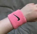 Напульсники Nike SWOOSH WRISTBANDS 2 шт рожеві N.000.1565.677.OS