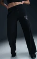 Спортивные штаны женские Nike SPORTSWEAR CLUB FLEECE MID-RISE WIDE-LEG GRAPHIC PANTS черные HJ0869-010
