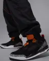 Спортивные штаны Nike JORDAN BROOKLYN DRAFT черно-оранжевые IB1047-011