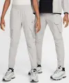 Спортивні штани підліткові Nike SPORTSWEAR CITY UTILITY CARGO світло-сірі FZ4904-009