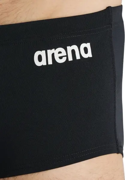 Плавки-боксеры Arena TEAM SWIM LOW WAIST SHORT SOLID черно-белые 004775-550