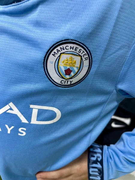 Футбольна форма з довгим рукавом дитяча Манчестер Сіті (Manchester City) 2024/2025 домашня блакитно-біла F0150