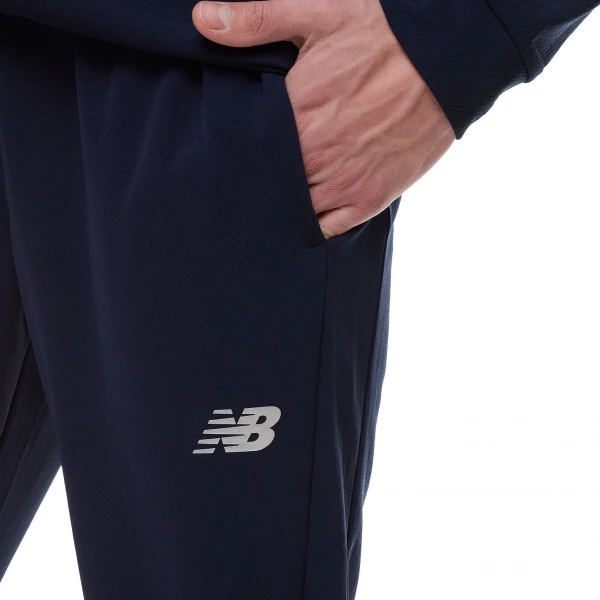 Спортивные штаны New Balance Tech Training Knit Track синие MP21033ECL