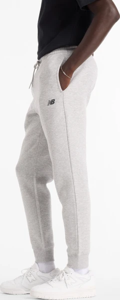 Спортивні штани New Balance SPORT FLEECE світло-сірі MP43904AG