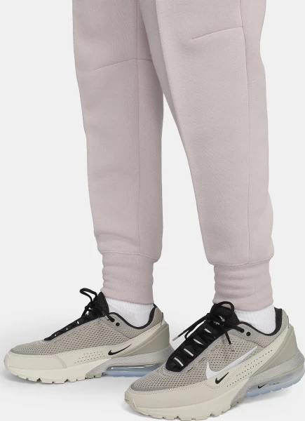 Спортивні штани жіночі Nike W TCH FLC MR JGGR світло-рожеві FB8330-019