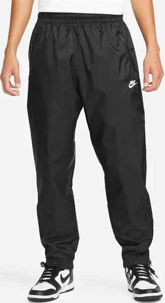 Спортивні штани Nike WINDRUNNER WOVEN LINED PANTS чорні DX0653-011