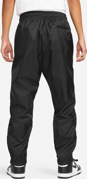 Спортивні штани Nike WINDRUNNER WOVEN LINED PANTS чорні DX0653-011