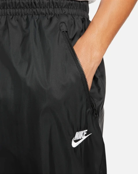 Спортивні штани Nike WINDRUNNER WOVEN LINED PANTS чорні DX0653-011
