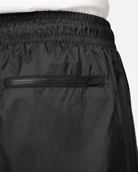 Спортивні штани Nike WINDRUNNER WOVEN LINED PANTS чорні DX0653-011