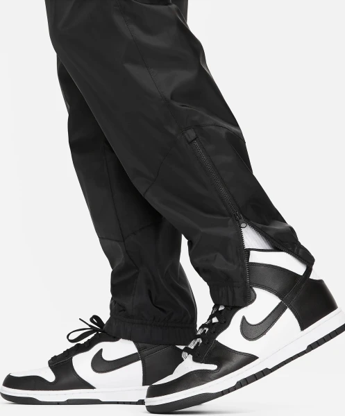 Спортивні штани Nike WINDRUNNER WOVEN LINED PANTS чорні DX0653-011