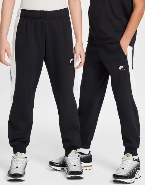 Спортивний костюм підлітковий Nike AIR FLEECE чорно-білий HF8812-010__HF8811-010