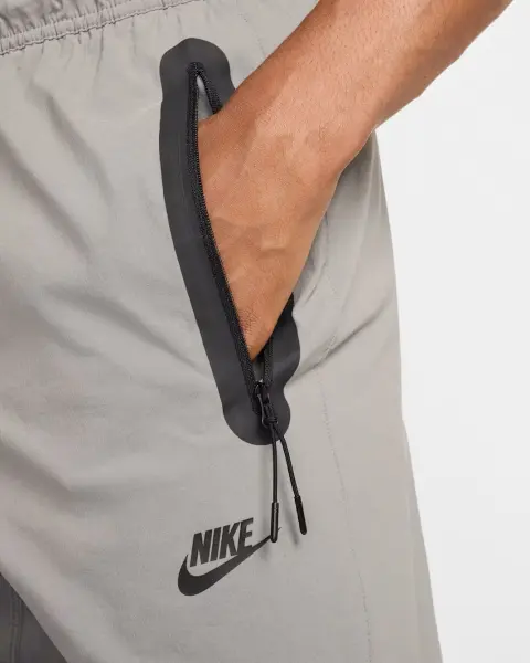 Спортивні штани Nike TECH WOVEN сірі HM8241-014