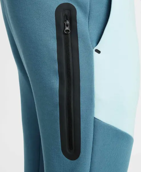 Спортивные штаны подростковые Nike SPORTSWEAR TECH FLEECE темно-бирюзово-голубые HV5869-006