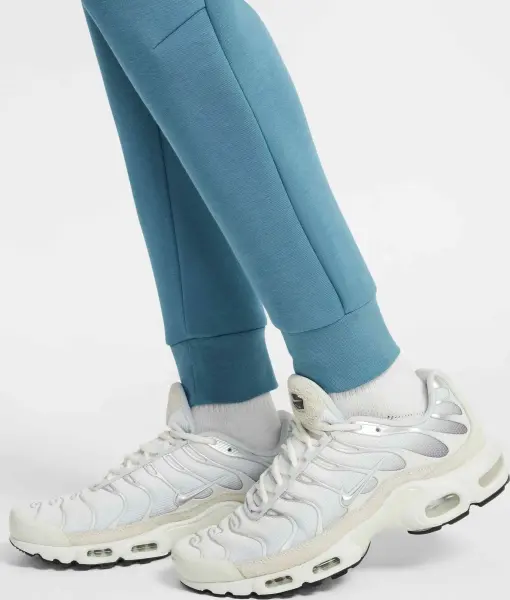 Спортивные штаны подростковые Nike SPORTSWEAR TECH FLEECE темно-бирюзово-голубые HV5869-006