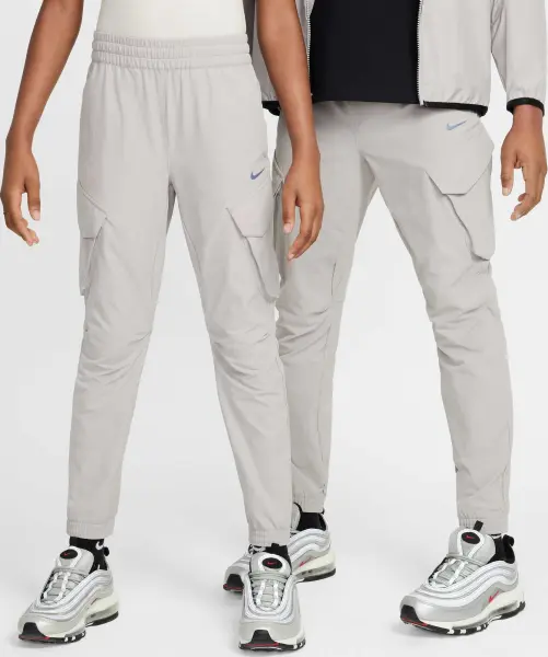 Спортивні штани підліткові Nike SPORTSWEAR CITY UTILITY CARGO світло-сірі FZ4904-009