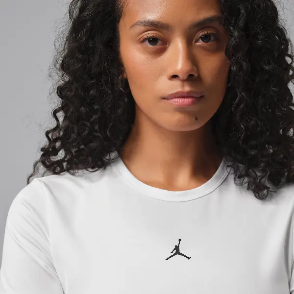 Футболка спортивна жіноча Nike JORDAN SPORT DRI-FIT ESSENTIALS біло-чорна IF2354-100